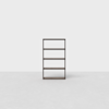 Minimalist dark wood bookshelf with four shelves, standing alone on a light gray floor against a plain white background. The design is simple and modern.
