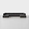 A large, modern, dark gray sectional sofa with low backrests and clean lines is arranged in a U-shape on a light gray floor against a plain white background.
