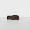 A dark wood storage box with one open drawer and a minimalist design, set against a plain white background.