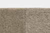 Close-up of two types of beige carpet textures side by side: the left side is plush and smooth, while the right side has a looped, coarse texture. Both carpets are shown against a white background.