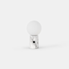 A modern table lamp with a round white frosted glass shade on top of a cylindrical white marble base featuring gray veins and a small black circular accent on the front, set against a plain white background.