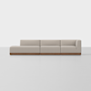 A modern sectional sofa with light beige upholstery and a wooden base, consisting of three connected seats including a left chaise and a right armrest, set against a plain white background.