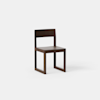 A simple, modern wooden chair with a straight backrest and square legs, shown against a plain white background.