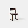 A simple, modern wooden chair with a straight backrest and square legs, shown against a plain white background.