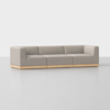 A modern, minimalist light gray three-seater sofa with clean lines and a low wooden base, placed on a seamless light gray floor with a plain white background.