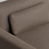 Close-up view of a brown textured fabric sofa with a matching rectangular cushion against the backrest, highlighting the upholstery and minimalist design.