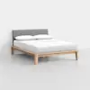 A modern bed with a light wood frame, gray upholstered headboard, and neatly made white bedding with two pillows, set against a plain white background.