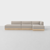 A modern L-shaped beige sectional sofa with a low wooden base, set against a plain white background on a light, smooth floor.