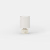 Small cylindrical table lamp with a beige base and a matching fabric drum shade.