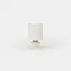 Small cylindrical table lamp with a beige base and a matching fabric drum shade.