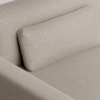Close-up of a light beige, textured fabric sofa with a matching rectangular back cushion, showing the upholstery detail and clean, modern lines of the furniture.