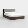A modern wooden bed frame with a gray upholstered headboard, white bedding, and two pillows, set against a plain white background.