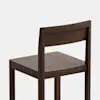 A simple, modern wooden chair with a flat seat, straight legs, and a rectangular backrest, shown against a plain white background.