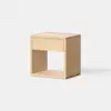 A minimalist wooden nightstand with a single drawer and an open shelf below, set against a plain white background.