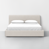 A modern, beige upholstered bed with a tufted headboard, white sheets, and two white pillows, set against a plain white wall and gray floor in a minimalistic bedroom setting.