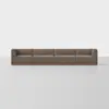 A modern, four-seat sectional sofa with brown upholstery and a wooden base, set against a plain light gray background.