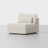A modern, armless lounge chair with plush cream-colored upholstery, a boxy shape, and a matching rectangular back cushion, set against a plain white background.