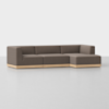 A modern sectional sofa with brown upholstered cushions and a light wooden base, featuring a right-side chaise lounge, set against a plain white background.