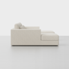 Side view of a modern, light beige sectional sofa with clean lines and plush cushions, set against a plain white background.