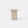 Minimalist, light beige stone side table with a cylindrical base and a flat, square top, set against a plain white background.