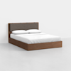 A modern wooden bed with a brown upholstered headboard, white bedding, and two pillows, placed in a minimalistic room with a light gray floor and white walls.