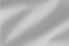 Light gray, soft fabric with gentle folds and a subtle texture, creating smooth, wavy patterns across the surface.