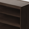 A close-up view of a dark brown wooden shelving unit with two open shelves and a smooth top surface.