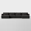 A modern, dark gray sectional sofa with four connected seats, low backs, and matching cushions, set against a plain white background.
