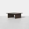 A modern square coffee table made of dark wood with thick, flat legs and a smooth surface, set against a plain white background.