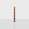 A tall, narrow wooden bookshelf with five small shelves is centered against a plain white background. The design is minimalist and symmetrical.