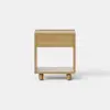 A minimalist wooden nightstand with a single drawer and an open shelf underneath, set against a plain white background. The nightstand stands on four short, cylindrical legs.