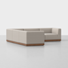 A modern, L-shaped sectional sofa with light beige upholstery and a wooden base, set against a plain white background.