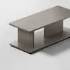 A minimalist wooden coffee table with a rectangular top and base, connected by two wide vertical panels, set on a light, plain surface.