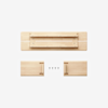 Disassembled light wood shelf with three main flat pieces and five black screws arranged on a white background.