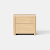 A light wood nightstand with two drawers, minimalist design, and rounded corners, set against a plain white background.