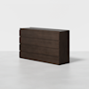 A dark brown wooden dresser with eight drawers, set against a plain white background on a light gray floor. The dresser has a modern, minimalist design with clean lines and no visible handles.