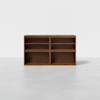 A wooden cabinet with a natural brown finish, featuring six open shelves in two columns, standing on a plain light-colored floor against a white background.