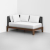 A modern daybed with a wooden frame, white mattress, and three white pillows, positioned against a corner with plain white and gray walls.