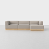 A modern beige sectional sofa with wooden base and right-side chaise lounge is displayed against a plain white background.