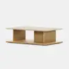 A modern rectangular coffee table with a light wood base, open center storage, and a smooth, beige stone top, set against a plain white background.