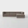 A modern, L-shaped sectional sofa with brown upholstery and low-profile wooden legs, set against a plain white background.