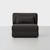 A modern, armless dark gray lounge chair with a rectangular backrest cushion, set against a plain white background.