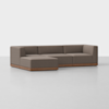 A modern L-shaped sectional sofa with brown upholstery and a low wooden base, set in a minimal, light-colored room with a plain background.