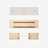 Four wooden components and four black screws are neatly arranged on a white background, appearing to be parts for assembling a simple wooden item, such as a shelf or a small piece of furniture.