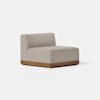 A modern armless lounge chair with light beige upholstery and a wooden base, set against a plain white background.