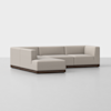 A modern L-shaped sectional sofa with light beige upholstery and a dark wooden base, set against a plain white background.