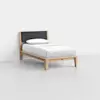 A minimalist twin bed with a light wooden frame, black upholstered headboard, and white bedding with a pillow, placed in a plain, empty room with light gray flooring and white walls.