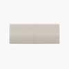 A rectangular light beige fabric-covered cushion, viewed from above, with a faint vertical seam dividing it into two equal sections.
