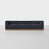 A modern, dark blue three-seat sofa with a wooden base, positioned against a plain white background. The sofa has clean, square lines and a minimalist design.