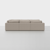 A modern beige sectional sofa with clean lines and three seat sections, viewed from the back against a plain white background.